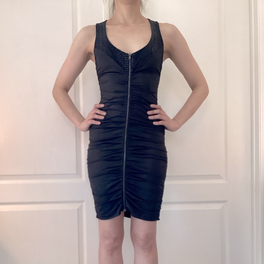 Bebe stretch front zip dress with back studs size S